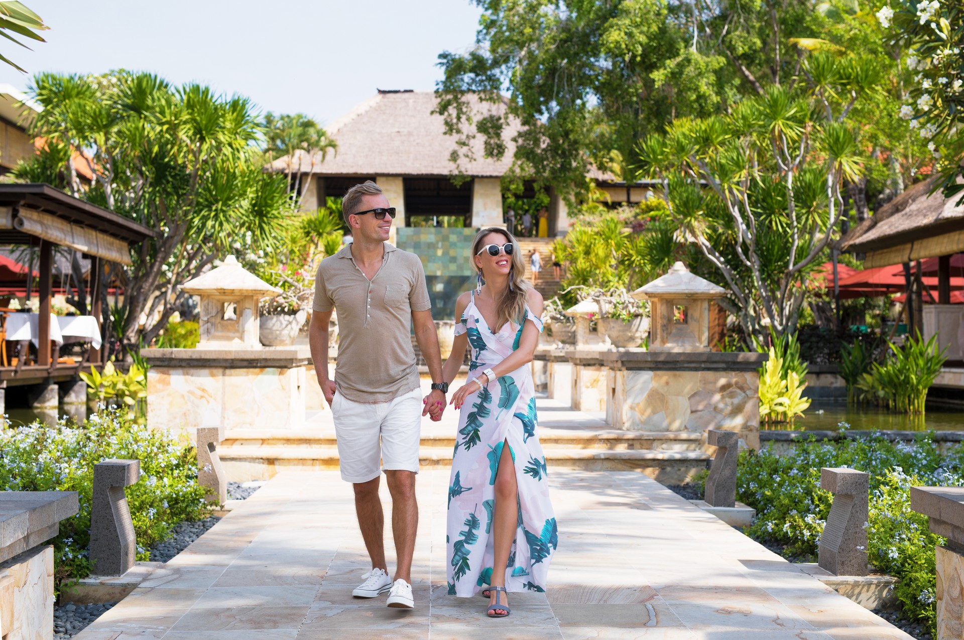 Romantic couple walking in tropical resort.